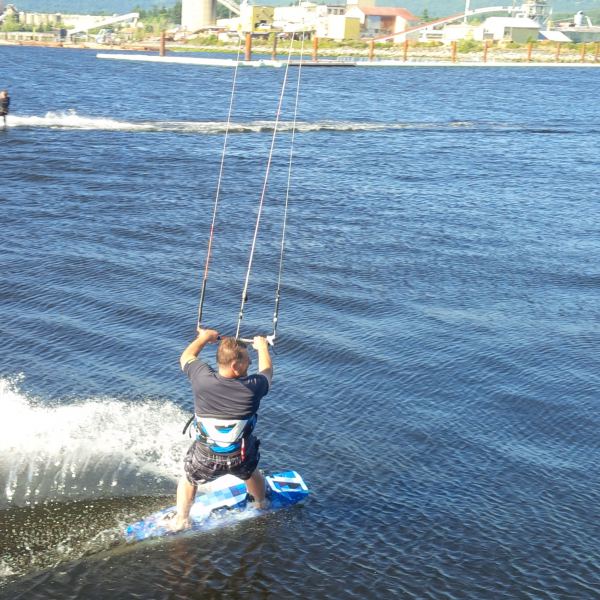 HQ pier: Dale speeding by onlookers
Dale enjoying the 23 knots flat water. Wide open inlet :)
