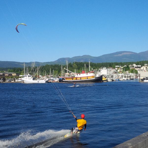 PA, leeward side of Centennial Pier, in front of 'Swept Away Inn' Tugboat
Jacob and Dale kiting in the protected water beside HQ pier
