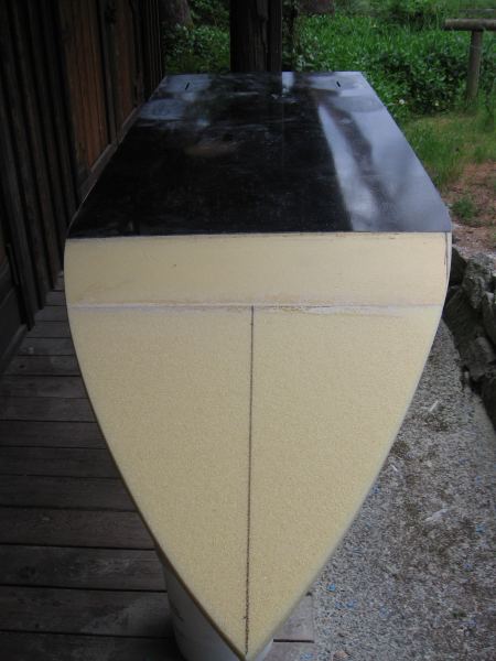 Carbon Kevlar Torsion box hull with bow glued on and cut to shape
