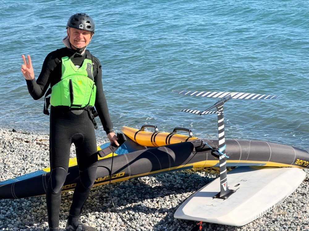 Greg, happy on the beach in Ross Bay with his wingfoiling gear